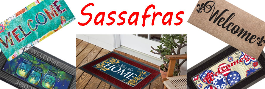 This image features five Sassafras: Wonderfully Quirky Welcome, Burlap Welcome, Patriotic Ballons, Bless this Home and Be A Light either as stand alone mats or in their trays.